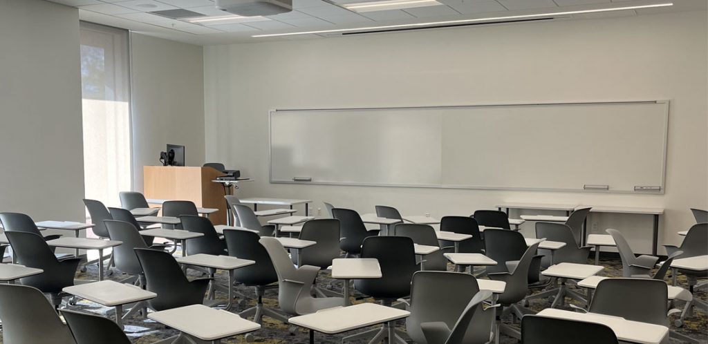 Ag and Natural Resources room 135 showing node chairs and podium for instructor with whiteboards on the wall