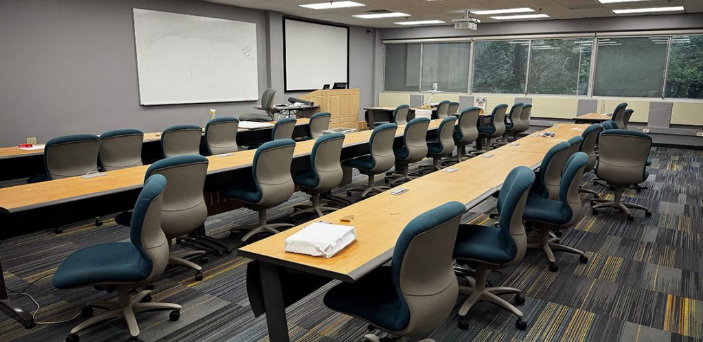 BEC room 116 with rows and tables of chair facing the front of the classroom