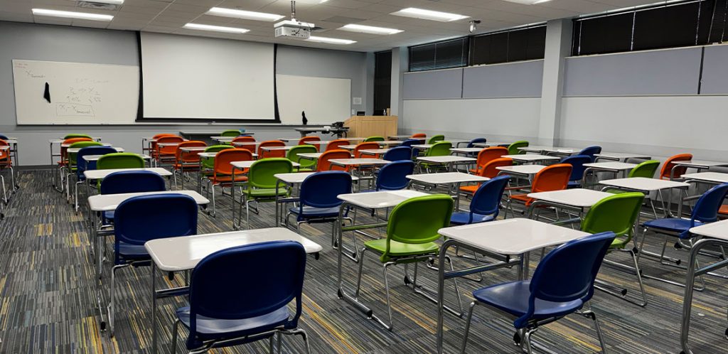 BEO 266 with individual chairs with tables across the classroom facing the front