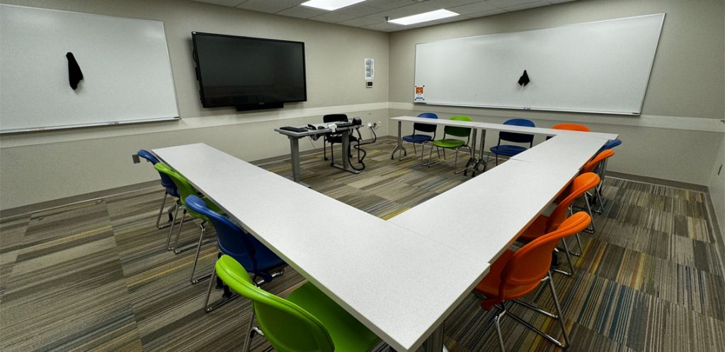 Claxton room 209 showing tables in a square with chairs around the square.