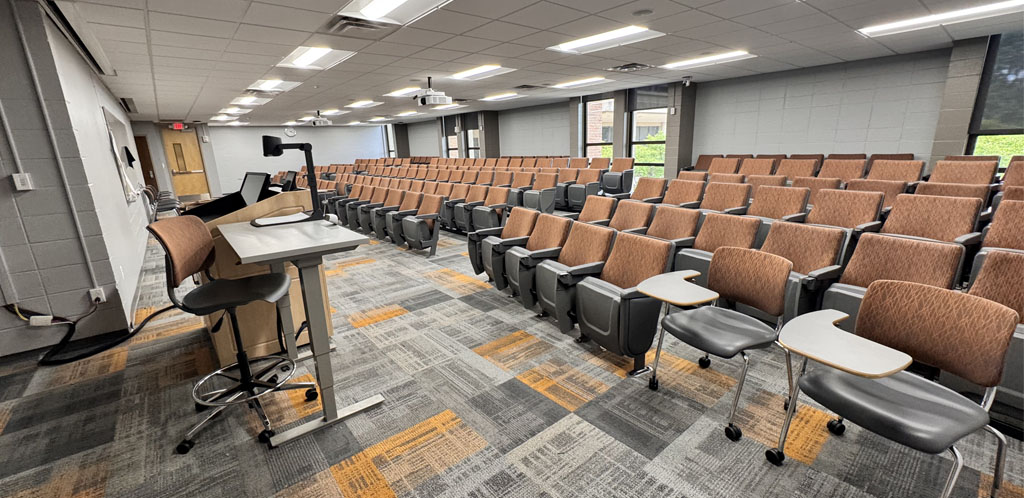 HSS 123 classroom showing theater style seats and instructor podium
