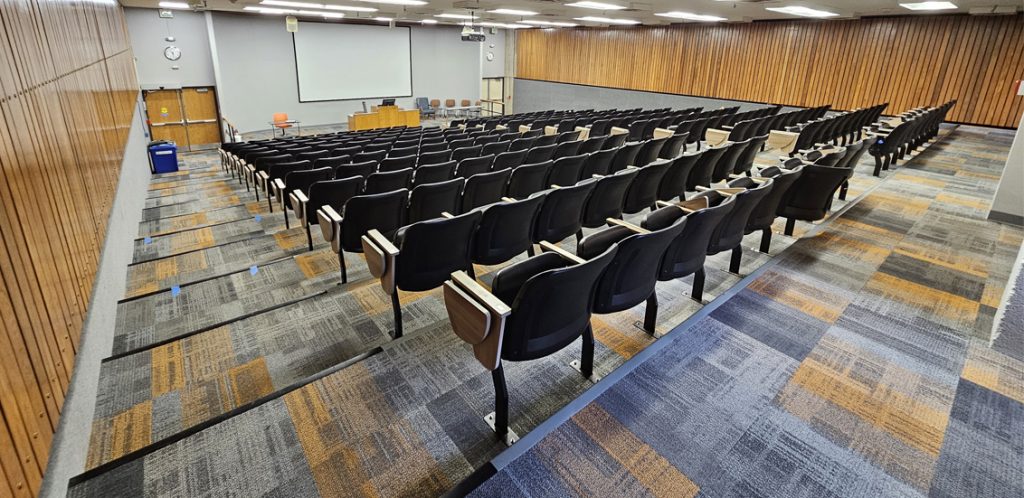 Stokely Management G2. Room includes theater style seating. Instructor podium includes the control panel, instructor screen, and a spot for laptop. Next to the podium is a table that includes the document camera.