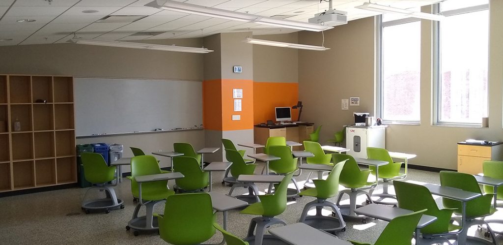 Strong 235. Room includes node chairs that can be moved into different configurations. Instructor desk includes the control panel, instructor screen, and a document camera.
