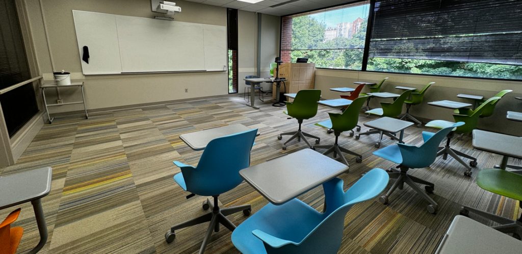 Walters room M401 with chairs lined in several rows facing the whiteboard